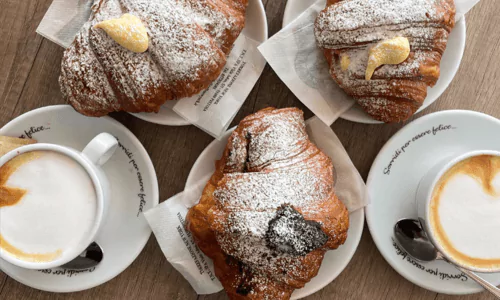 3 pastries filled with crema and Nutella served with the best Italian coffee in a cappuccino